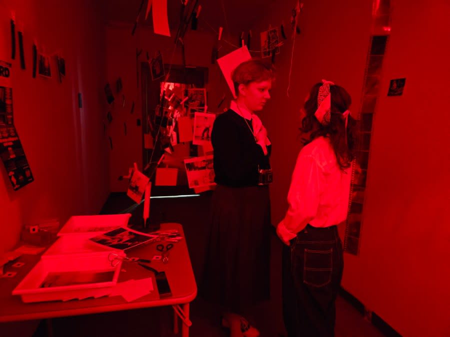 Jean Tegtmeyer, left, with Alice Sylvie (an Augie sophomore) in the dark room of “The Stacks.”