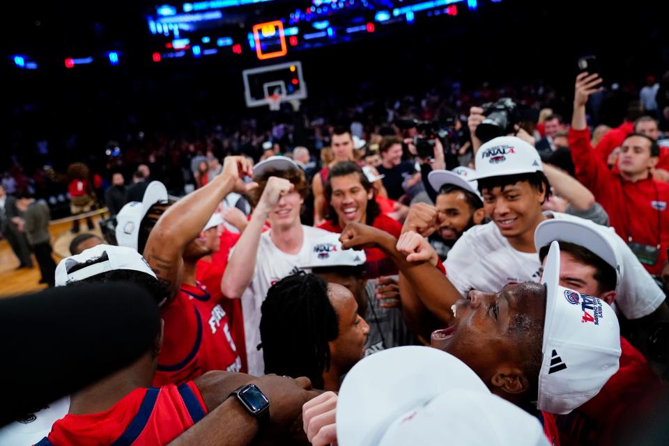 Florida Atlantic players celebrate after defeating Kansas State in an Elite 8 college basketball game in the NCAA Tournament's East Region final, Saturday, March 25, 2023, in New York. (AP Photo/Frank Franklin II)