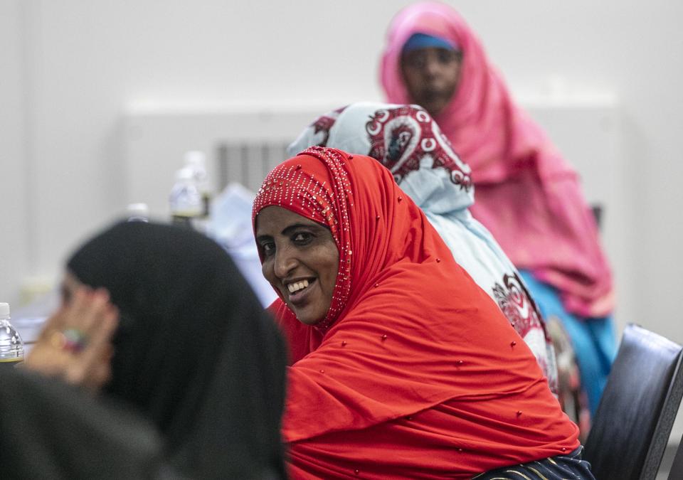 Zeinab Omar smiles while waiting for the Fundamentals of Infant and Toddler Care class to begin Sunday, Sept. 11 at Family and Child Care Resources of Northeast Wisconsin in Green Bay. The class is being offered to Somali women, with the help of a translator, as part of the Culturally Responsive Child Care Partnership.