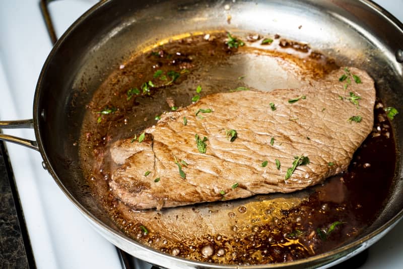 Stanley Tucci's steak recipe frying in pan