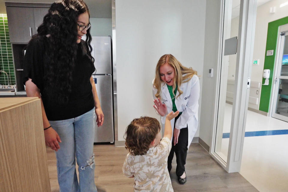Bianca Chavarria's younger child greets Dr. Caitlin Martin. (NBC News)