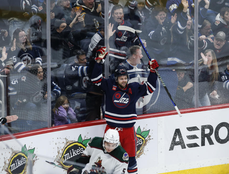 Winnipeg Jets' Josh Morrissey (44) celebrates his goal against the Arizona Coyotes during the third period of an NHL hockey game, Saturday, Nov. 18, 2023 in Winnipeg, Manitoba. (John Woods/The Canadian Press via AP)