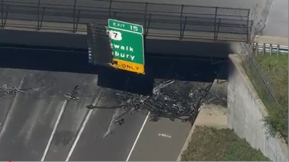 <div><strong>SkyFOX </strong>images show the burned exit sign with debris scattered across the highway.</div>