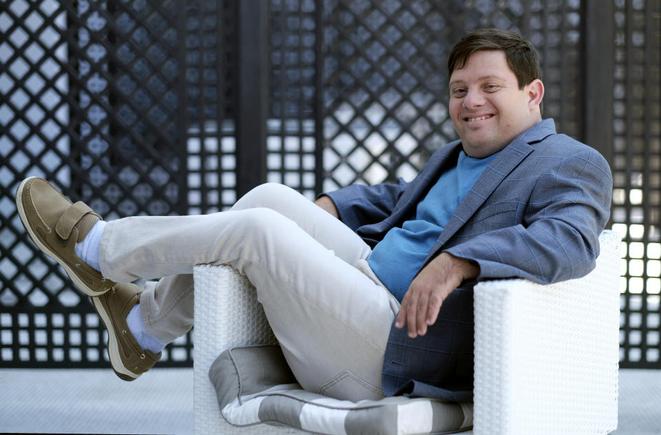 In this Friday, Aug. 2, 2019 photo, Zack Gottsagen, a cast member in the film "The Peanut Butter Falcon," poses for a portrait at the London West Hollywood, in West Hollywood, Calif. The movie opens in the U.S. on Aug. 9. (Photo by Chris Pizzello/Invision/AP)