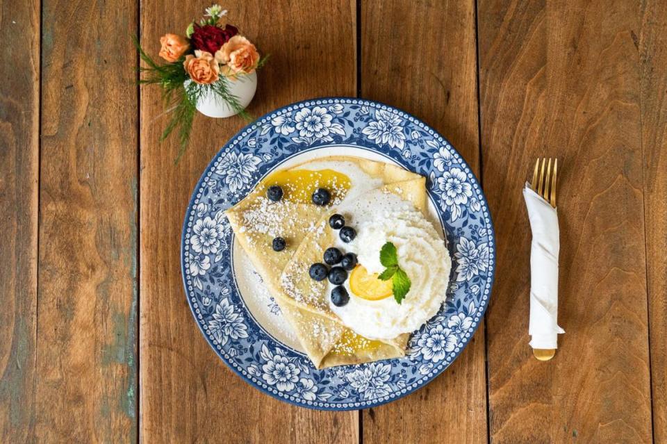 The Clean crepe at Seven Swans Creperie is filled with lavender lemon curd and topped with blueberries, candied lemons, fresh mint and whipped cream.