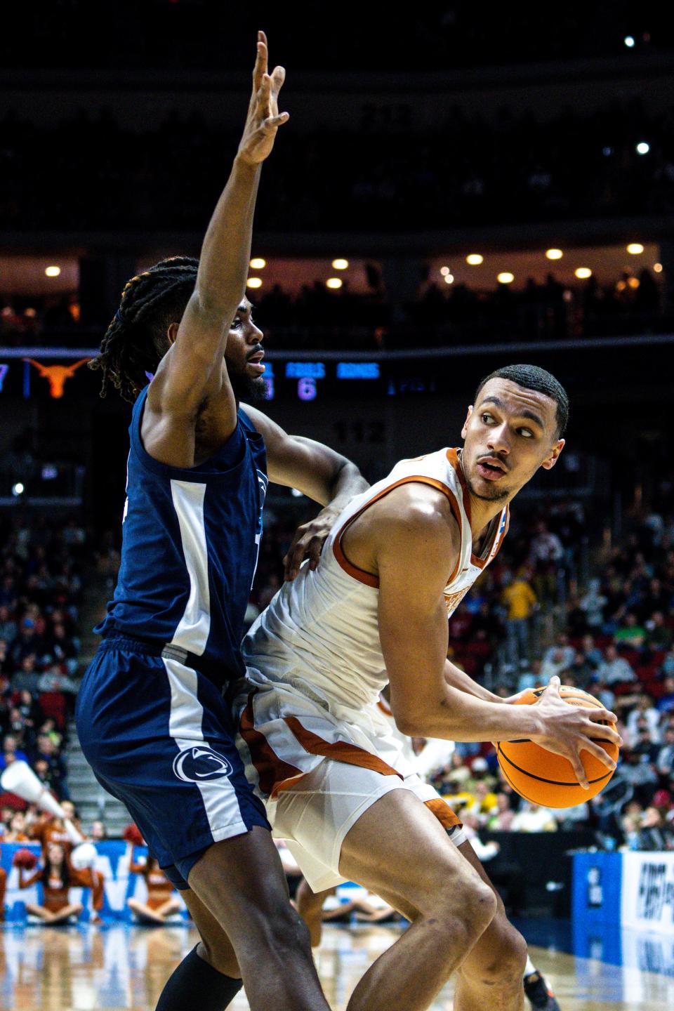 Penn State guard Evan Mahaffey guards Texas forward Dylan Disu during an NCAA menÕs basketball tournament second round basketball game on Saturday, March 18, 2023, at Wells Fargo Arena, in Des Moines, Iowa.