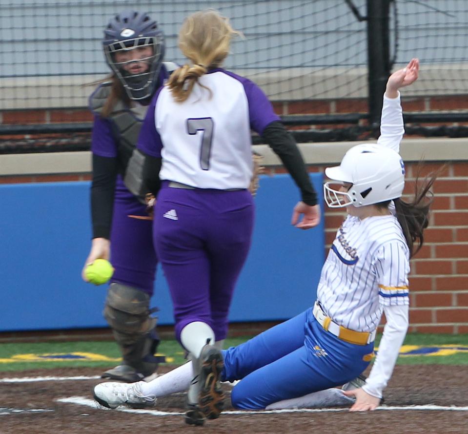 Mitchell's pinch runner, Miley Teague (9) scores a run for Mitchell in the game against Paoli Friday, April 5, 2024.