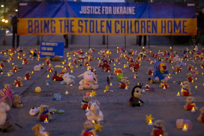 Thousands of teddy bears with candles on display at a protest in Brussels in February 2023 represented abducted Ukrainian children. <a href="https://media.gettyimages.com/id/1247412476/photo/brussels-avaaz-symbolic-action.jpg?s=1024x1024&w=gi&k=20&c=nYS6DL3A3cpyKMVvXwRjOh0yjhMbTCaKx_5ceu_in_s=" rel="nofollow noopener" target="_blank" data-ylk="slk:Nicolas Maeterlinck/Belga MAG/AFP via Getty Images;elm:context_link;itc:0" class="link ">Nicolas Maeterlinck/Belga MAG/AFP via Getty Images</a>