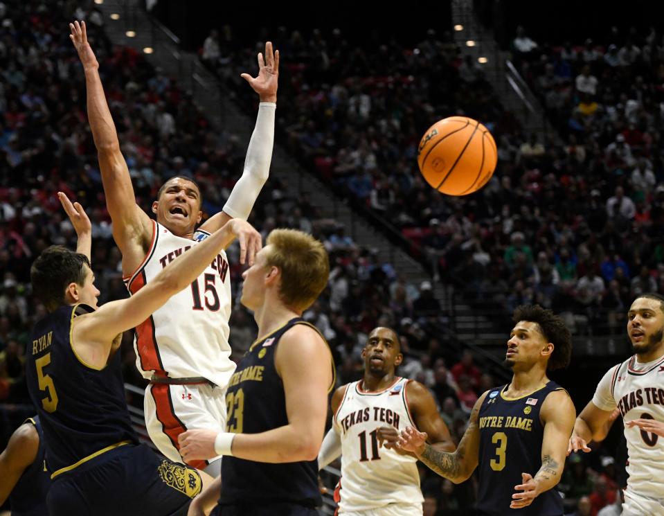 Texas Tech's Kevin McCullar (15) is fouled at the game against Notre Dame in the NCAA tournament's second round game, Sunday, March 20, 2022, at Viejas Arena in San Diego, California. Texas Tech won, 59-53.