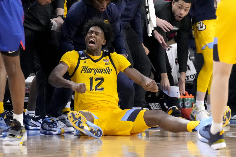 Marquette's Olivier-Maxence Prosper reacts after making a three-point shot and getting fouled during the second half of an NCAA college basketball game against DePau, Saturday, Jan. 28, 2023, in Chicago. Marquette won 89-69. (AP Photo/Charles Rex Arbogast)