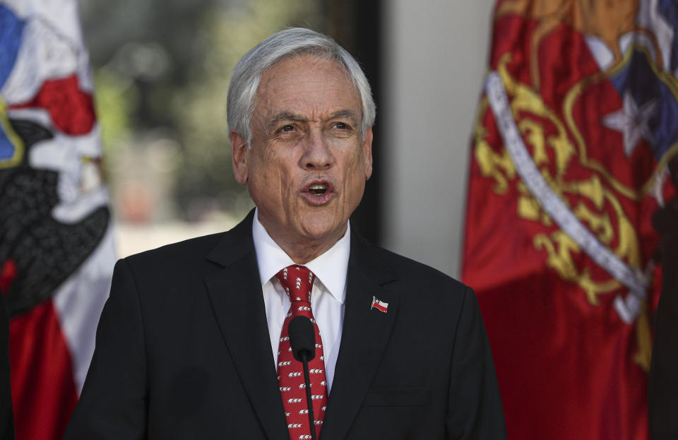 Chilean President Sebastian Pinera gives a statement at La Moneda presidential palace in Santiago, Chile, Thursday, Nov. 7, 2019. Pinera sent a bill to Congress on Wednesday that would raise the minimum wage, one of a series of measures to try to contain nearly three weeks of anti-government protests over inequality in one of Latin America's richest countries. (AP Photo/Esteban Felix)