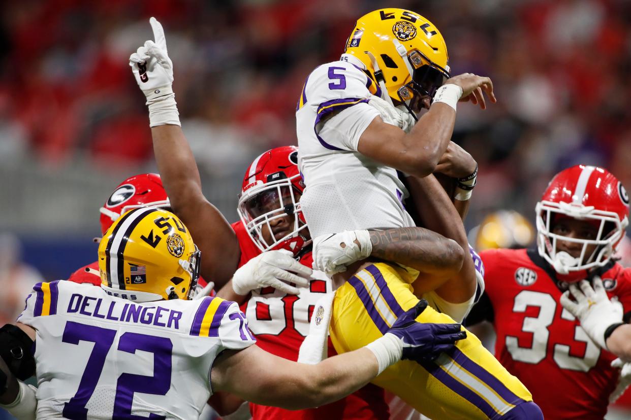 FILE - Georgia defensive lineman Jalen Carter (88) holds LSU quarterback Jayden Daniels (5) in the air in celebration after sacking Daniels during the first half of the SEC Championship NCAA college football game between LSU and Georgia in Atlanta, on Saturday, Dec. 3, 2022.
This photo was one of many that were recognized on Friday, June 9, 2023 in the Georgia Press Association Better Newspaper Contest.