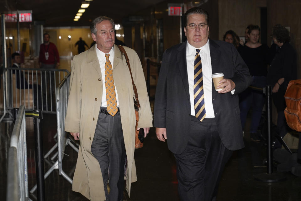 Defense attorneys Michael van der Veen, left, and William Brennan arrive to criminal court in New York, Tuesday, Nov. 1, 2022. The Trump Organization is on trial this week for criminal tax fraud. (AP Photo/Seth Wenig)