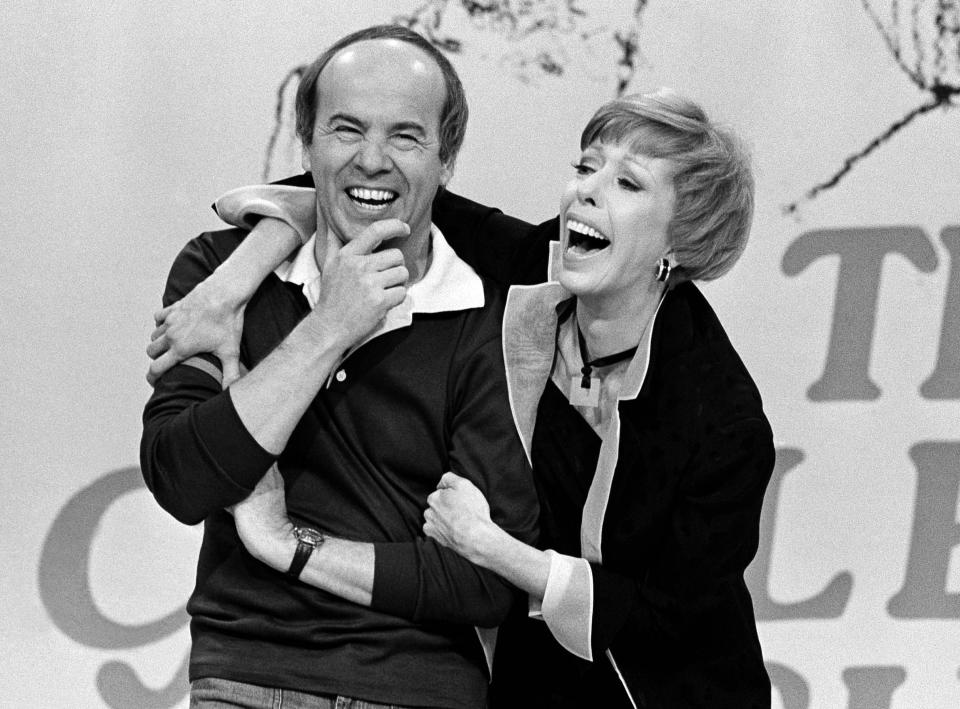 REMOVES REFERENCE TO HULU - FILE - Carol Burnett, right, shares a laugh with Tim Conway during a taping of her final show on March 19, 1978, in Los Angeles. Episodes of "The Carol Burnett Show" are available on streaming services like Tubi and The Roku Channel. (AP Photo/ George Brich, File)