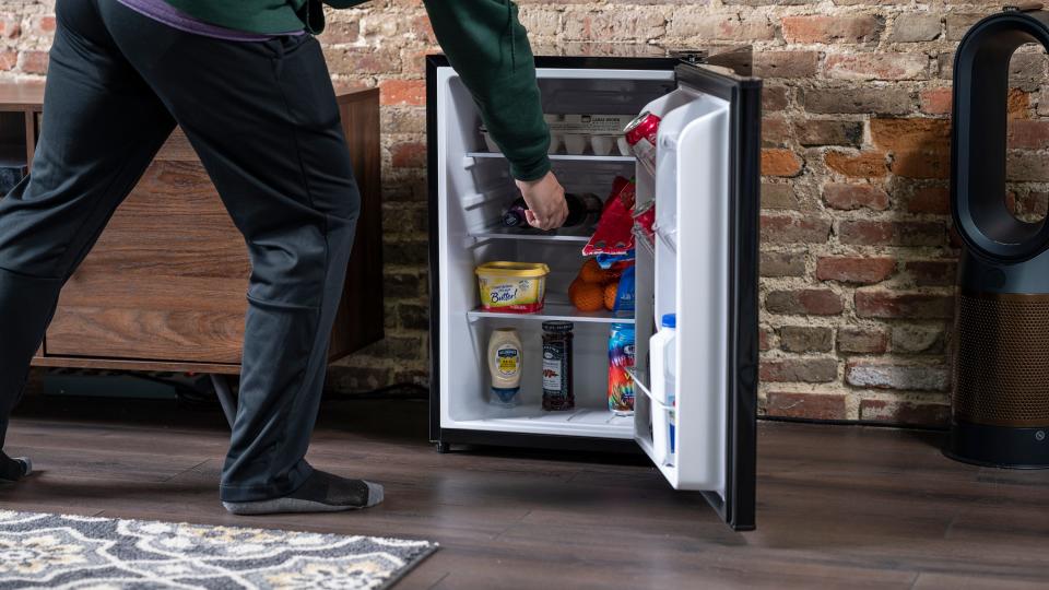 The Kenmore mini fridge can hold up to 72 canned drinks.