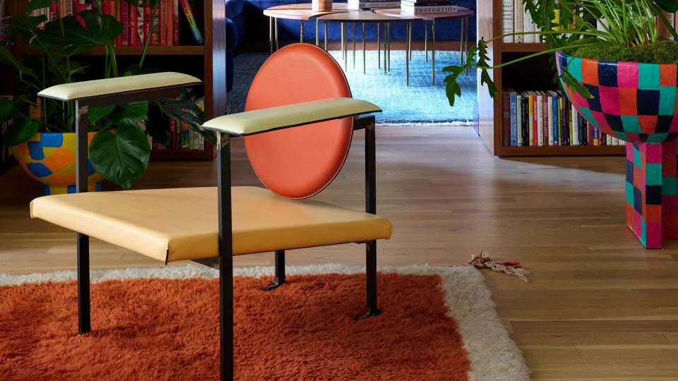 a room with a table and bookshelves