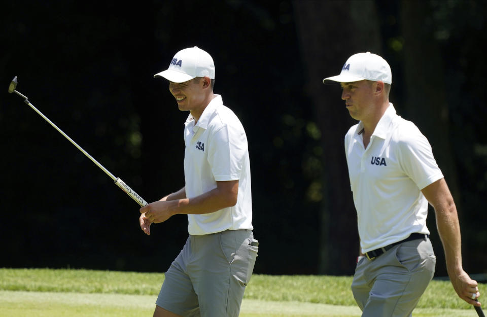 United States' Collin Morikawa, left, speaks with his teammate Justin Thomas during a practice round of the men's golf event at the 2020 Summer Olympics, Tuesday, July 27, 2021, at the Kasumigaseki Country Club in Kawagoe, Japan, (AP Photo/Matt York)