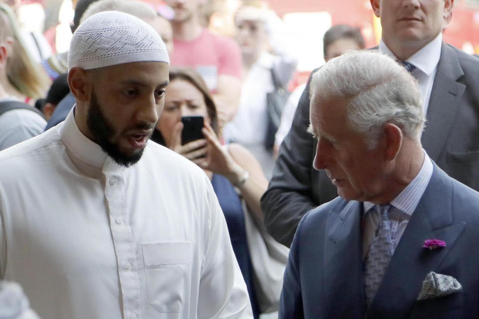 Prince Charles speaks to imam Mohammed Mahmoud (AP)