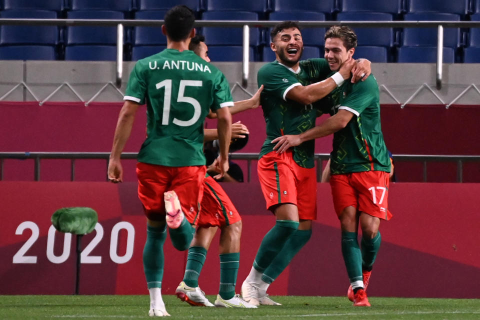 Mexico's players celebrate their third goal during the Tokyo 2020 Olympic Games men's bronze medal football match between Mexico and Japan at Saitama Stadium in Saitama on August 6, 2021. (Photo by Jonathan NACKSTRAND / AFP) (Photo by JONATHAN NACKSTRAND/AFP via Getty Images)