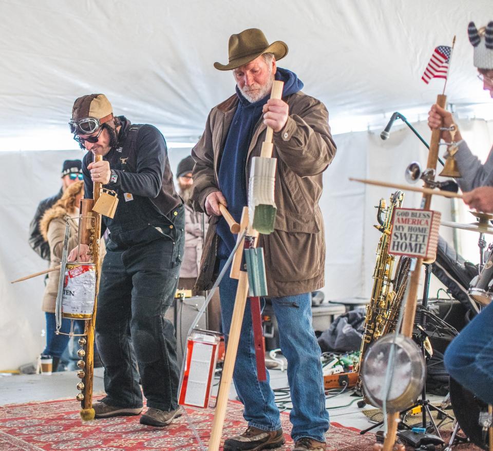 Festival goers compete in the stumpf fiddle contest at last year's Fish Creek Winterfest. The contest has quickly become one of the annual festival's more popular events for participants and spectators alike..