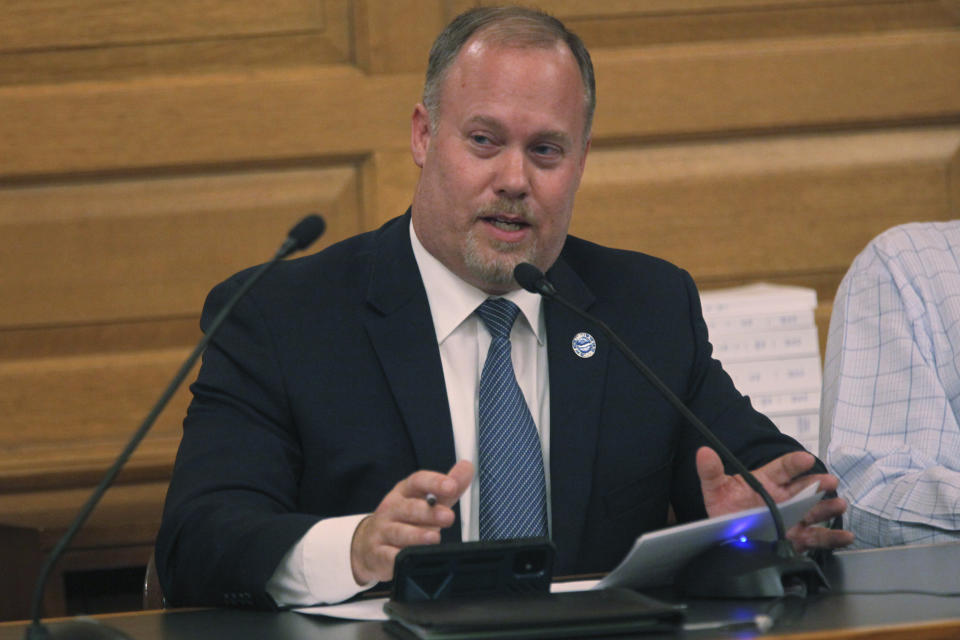 Kansas House Taxation Committee Chair Adam Smith, R-Weskan, explains a plan to cut taxes by $1.5 billion over three years to fellow Republicans in the House during a meeting, Friday, April 5, 2024, at the Statehouse in Topeka, Kan. Kansas lawmakers have approved the plan but some of them expect Gov. Laura Kelly to veto it. (AP Photo/John Hanna)