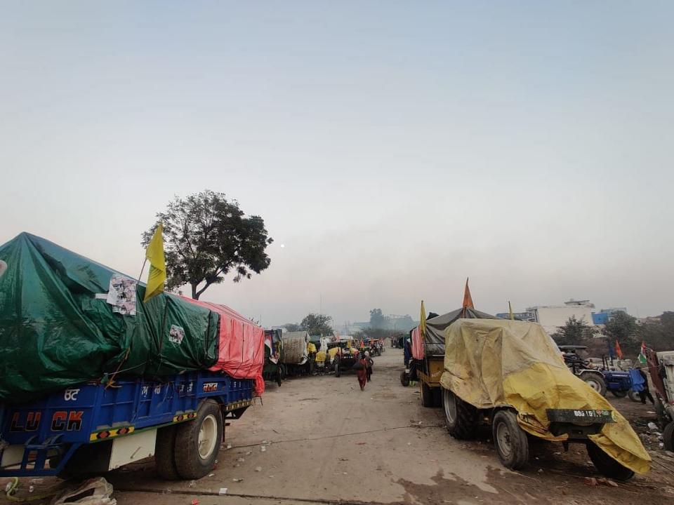 Tractors with Nishan Sahib flags parked at the protest site in Singhu.