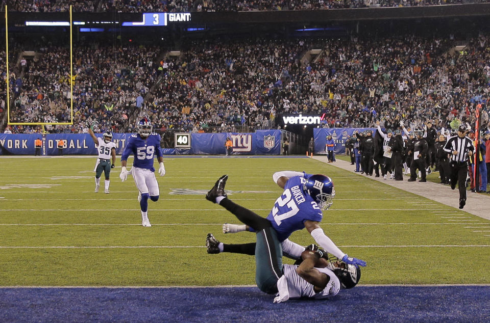 Philadelphia Eagles tight end Josh Perkins (81) scores a touchdown in front of New York Giants cornerback Deandre Baker (27) in the first half of an NFL football game, Sunday, Dec. 29, 2019, in East Rutherford, N.J. (AP Photo/Seth Wenig)