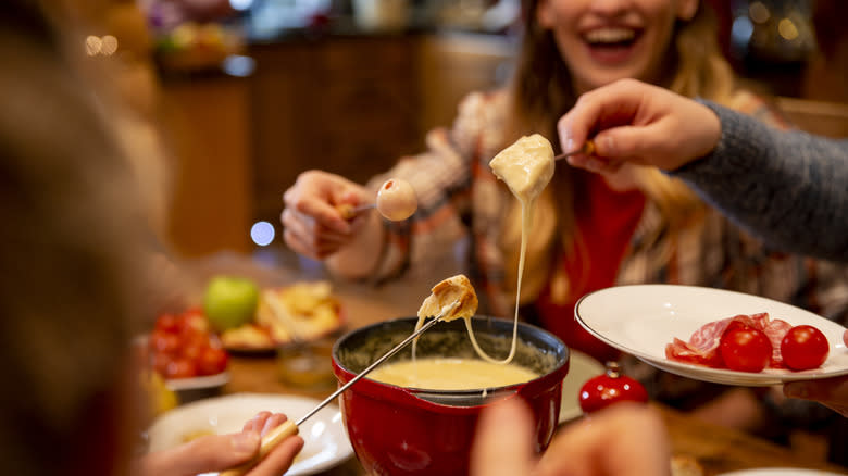Sharing fondue at restaurant 