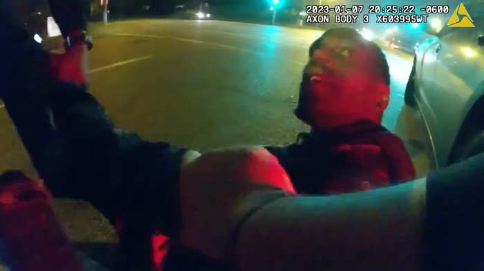 A screengrab from body-worn camera footage shows Tyre Nichols sitting on the ground before being brutally beaten by police.