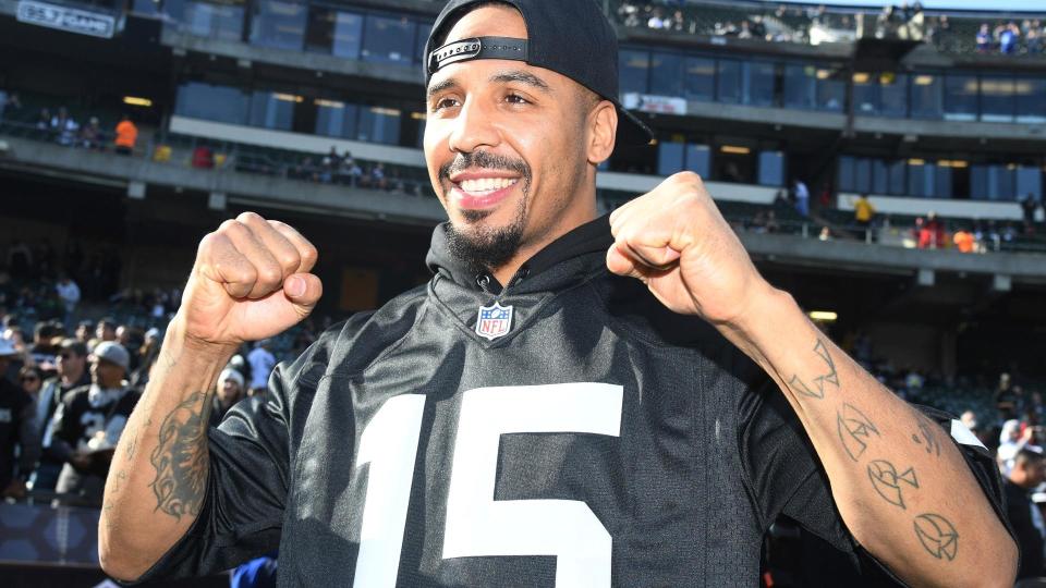 Andre Ward has some fun at a recent Raiders game. (AP)