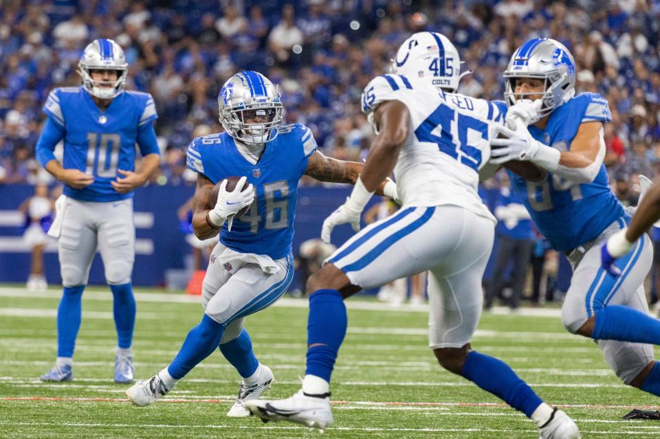 Aug 20, 2022; Indianapolis, Indiana, USA; Detroit Lions running back Craig Reynolds (46) runs the ball in the first quarter against the Indianapolis Colts at Lucas Oil Stadium.