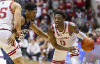 Indiana guard Xavier Johnson (0) makes a move with the ball while being defended by Penn State guard Jalen Pickett (22) during the second half of an NCAA college basketball game, Wednesday, Jan. 26, 2022, in Bloomington, Ind. (AP Photo/Doug McSchooler)