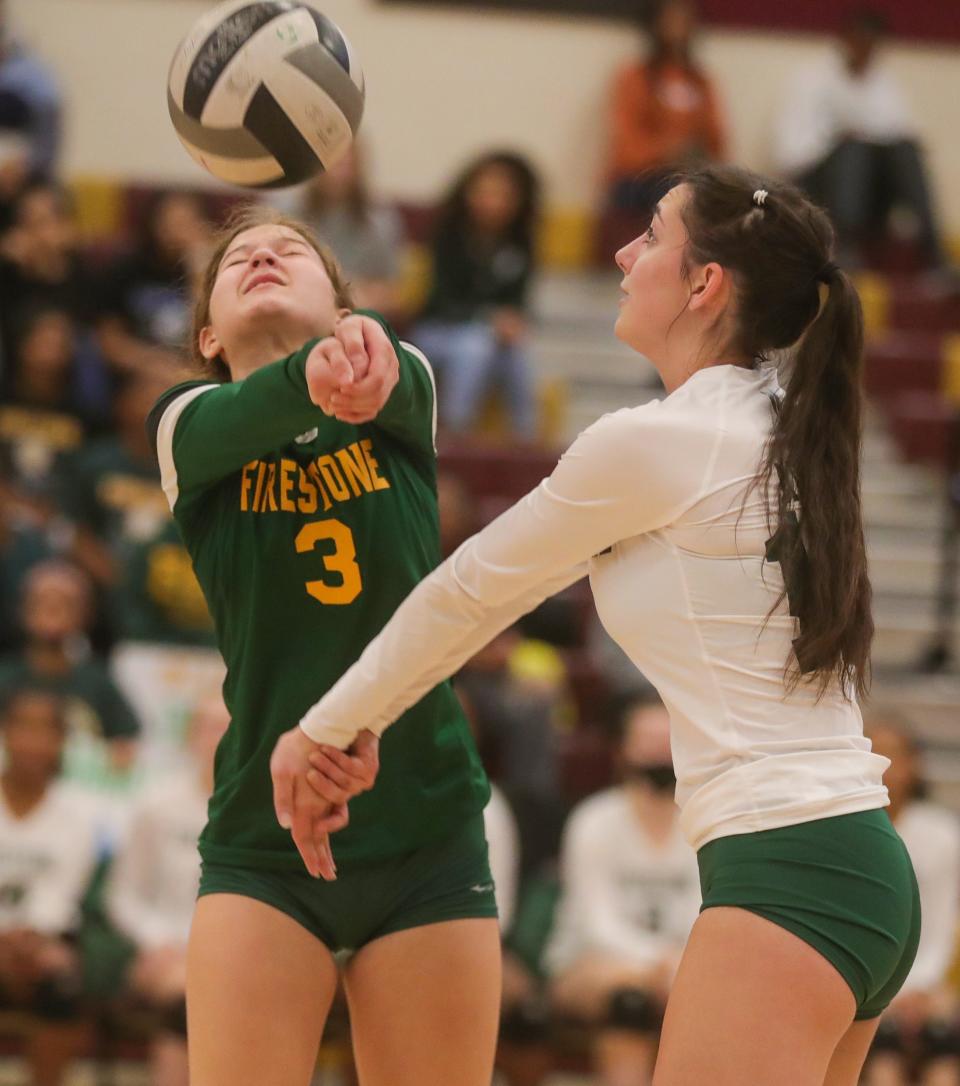 Firestone's Mariska Capper, left, and Ruth Adams look to return a Ellet serve in the City Series volleyball championship on Thursday, Oct. 13, 2022 in Akron, Ohio, at Garfield High School.