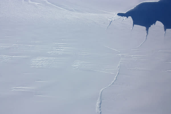 One end of the rift in Antarctica's Pine Island Glacier, seen from the NASA IceBridge DC-8 on Oct. 23, 2012. Since its discovery the crack has spread and is now less than one kilometer from completing and producing a large iceberg.