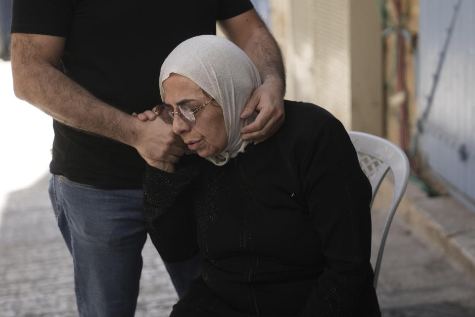 Nora Ghaith-Sub Laban reacts to her family's eviction from their home to make way for Israeli settlers in Jerusalem's Old City, Tuesday, July 11, 2023. As the last remaining Palestinians in a building filled with settlers, the Ghaith-Sub Labans have battled Israeli attempts to evict them from their Old City home for over 45 years. Settlers claim the family are squatters who had been living in an apartment formerly owned by Jews. (AP Photo/Mahmoud Illean)