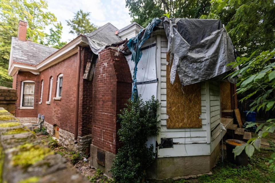 Tarp lies on part of the roof of one of two homes owned by Lexington’s director of historic preservation, Bettie Kerr, on South Ashland Avenue. Bettie Kerr had been repeatedly cited by code enforcement for several issues on both homes. July 22, 2021.