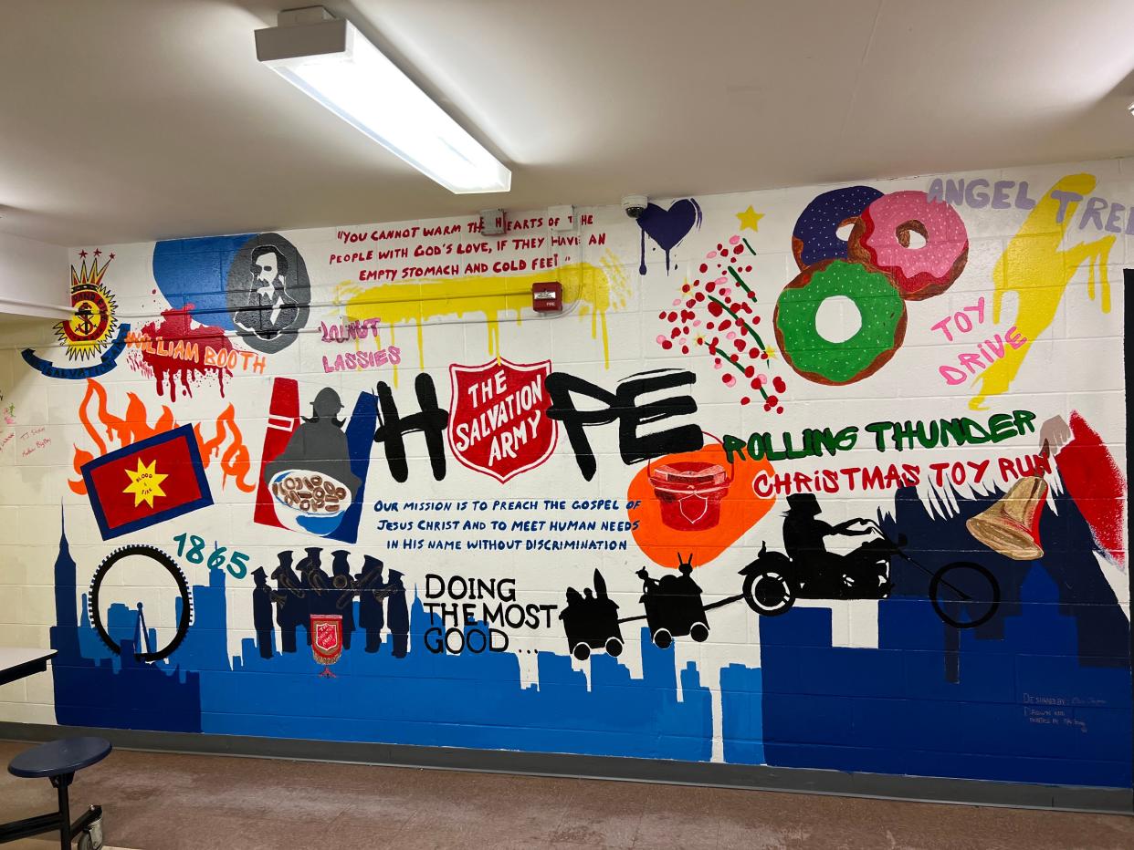 The wall of hope is a mural in the Salvation Army dining room on East Main Street in Newark. The mural was created by Mike Young, who is living at the shelter while working to turn his life around.