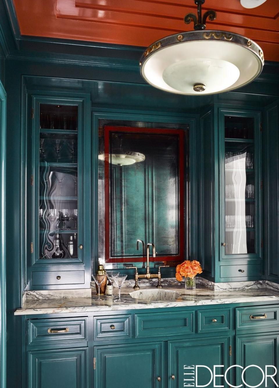 <p>In <a href="https://www.elledecor.com/design-decorate/house-interiors/a13120978/art-deco-apartment-chicago/" rel="nofollow noopener" target="_blank" data-ylk="slk:Steven Gambrel's Chicago apartment;elm:context_link;itc:0;sec:content-canvas" class="link ">Steven Gambrel's Chicago apartment</a>, the sink fittings in the butler’s pantry are by <a class="link " href="https://www.google.com/url?sa=t&rct=j&q=&esrc=s&source=web&cd=1&ved=0ahUKEwiOicyblrDXAhXC4IMKHSuJDjQQFggoMAA&url=https%3A%2F%2Fwww.kallista.com%2F&usg=AOvVaw0Injvb8u0I3Bsx81G29ROd" rel="nofollow noopener" target="_blank" data-ylk="slk:Kallista;elm:context_link;itc:0;sec:content-canvas">Kallista</a>, the counter is in Indigo Green marble, and the antique mirror is from <a class="link " href="https://www.google.com/url?sa=t&rct=j&q=&esrc=s&source=web&cd=1&ved=0ahUKEwjO-tuolrDXAhXL54MKHVbMD1AQFggoMAA&url=https%3A%2F%2Fogtstore.com%2F&usg=AOvVaw30f5YD-tpr3ptGEX4S95Fw" rel="nofollow noopener" target="_blank" data-ylk="slk:Olde Good Things;elm:context_link;itc:0;sec:content-canvas">Olde Good Things</a>; the cabinetry was painted in a custom high-gloss lacquer matched to <a class="link " href="https://www.google.com/url?sa=t&rct=j&q=&esrc=s&source=web&cd=1&ved=0ahUKEwivsZWylrDXAhUP3YMKHeMWBjYQFggpMAA&url=https%3A%2F%2Fwww.pantone.com%2F&usg=AOvVaw3i82sw-52eCvaOY1HC5czS" rel="nofollow noopener" target="_blank" data-ylk="slk:Pantone;elm:context_link;itc:0;sec:content-canvas">Pantone</a>’s Mallard Green.</p>