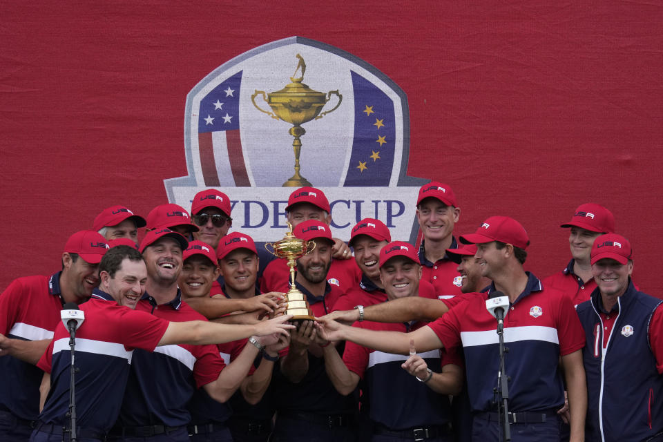 Team USA players pose with the trophy after the Ryder Cup matches at the Whistling Straits Golf Course Sunday, Sept. 26, 2021, in Sheboygan, Wis. (AP Photo/Ashley Landis)