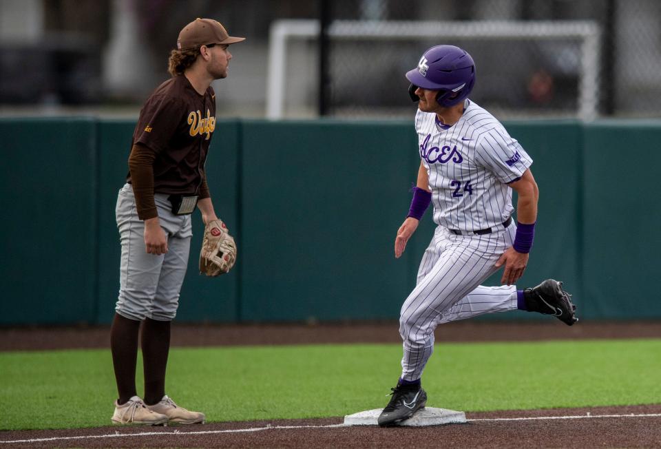 Evansville’s Eric Roberts (24) rounds third as the University of Evansville Purple Aces play the Valparaiso University Beacons at Charles H. Braun Stadium in Evansville, Ind., Friday evening, April 7, 2023.