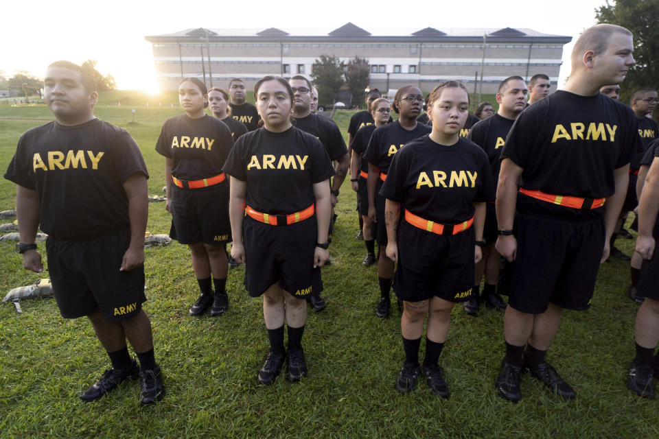 FILE - Students in the new Army prep course stand at attention after physical training exercises at Fort Jackson in Columbia, S.C., Aug. 27, 2022. The Army fell about 15,000 soldiers — or 25% — short of its recruitment goal this year, officials confirmed Friday, Sept. 30, despite a frantic effort to make up the widely expected gap in a year when all the military services struggled in a tight jobs market to find young people willing and fit to enlist. (AP Photo/Sean Rayford, File)