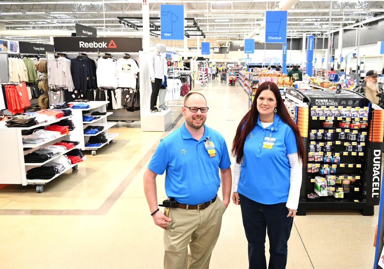 Walmart manager Gale Fix and HR manager Heidi Murphy in the main front aisle of the remodeled Coldwater store.