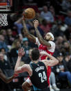 New Orleans Pelicans forward Brandon Ingram, top, shoots over Portland Trail Blazers forward Drew Eubanks (24) during the second half of an NBA basketball game in Portland, Ore., Monday, March 27, 2023. (AP Photo/Craig Mitchelldyer)