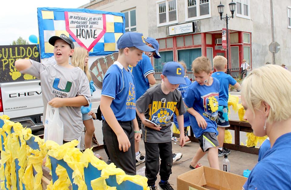 Members of Centreville Little League tested their arm-strength by tossing out candy at a past Covered Bridge Days parade. This year's parade is set for Saturday.