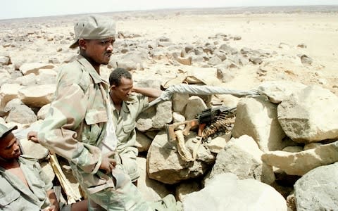 Eritrean soldiers wait at the Bure front in May 2000  - Credit: Sami Sallinen/Reuters
