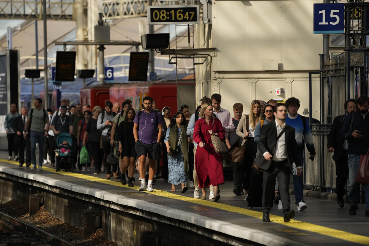 Passengers disembark from one of the few trains to arrive this morning at Waterloo railway station in London, Tuesday, June 21, 2022. Tens of thousands of railway workers walked off the job in Britain on Tuesday, bringing the train network to a crawl in the country’s biggest transit strike for three decades. (AP Photo/Matt Dunham)