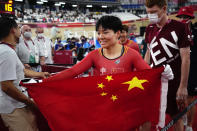 Shanju Bao of Team China celebrates winning the gold medal in the track cycling women's team sprint finals at the 2020 Summer Olympics, Monday, Aug. 2, 2021, in Izu, Japan. (AP Photo/Christophe Ena)