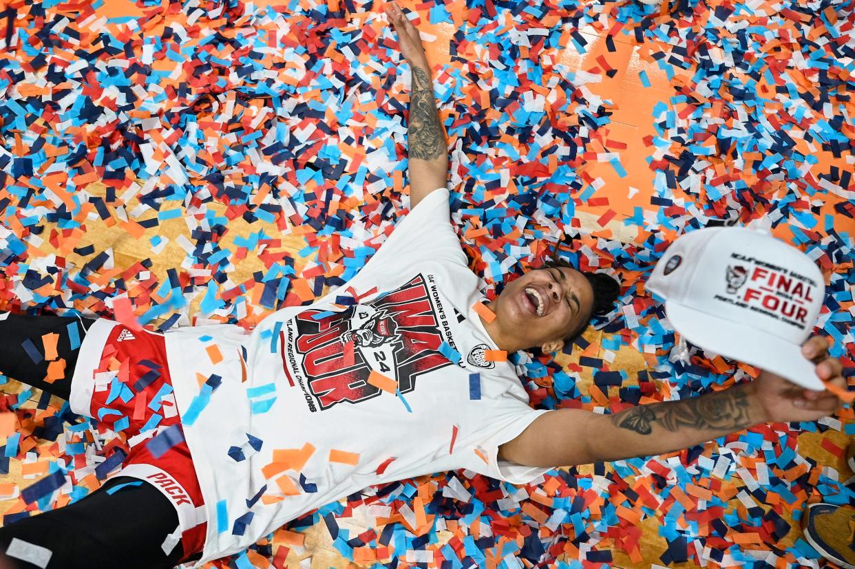 Wolfpack guard Aziaha James celebrates advancing to the Final Four.