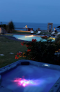 <p>Here’s a look at the pool, hot tub and scenic views at night. (Airbnb) </p>
