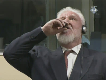 A wartime commander of Bosnian Croat forces, Slobodan Praljak, is seen during a hearing at the U.N. war crimes tribunal in the Hague, Netherlands, November 29, 2017. ICTV via REUTERS TV